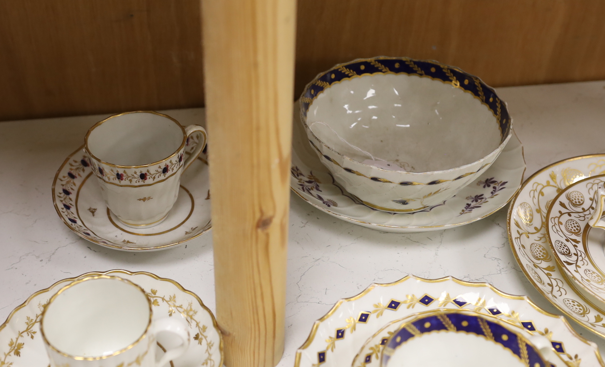 Two Flight Barr and Barr coffee can and matching saucer dish with gilded strawberries, four Flight cups and saucers, two Flight saucer dishes and a bowl together with a Chamberlain coffee can and saucer, bowl 15cm diamet